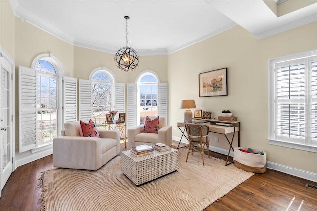 interior space with a healthy amount of sunlight, wood finished floors, and a notable chandelier