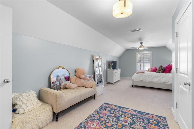 bedroom with lofted ceiling, light carpet, a ceiling fan, visible vents, and baseboards