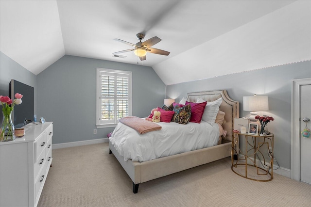 bedroom featuring visible vents, a ceiling fan, light carpet, vaulted ceiling, and baseboards