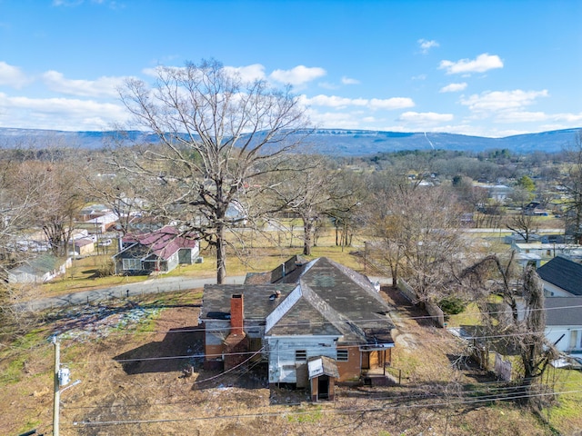 birds eye view of property with a mountain view