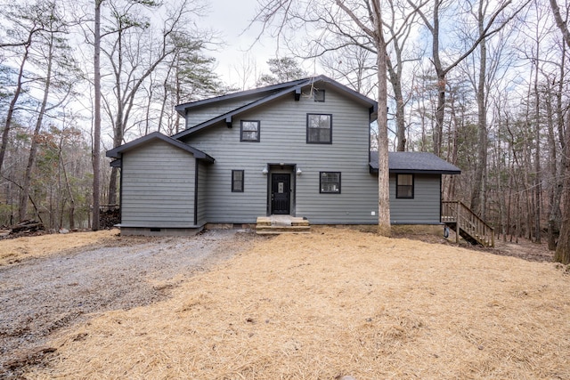 rustic home with crawl space and dirt driveway