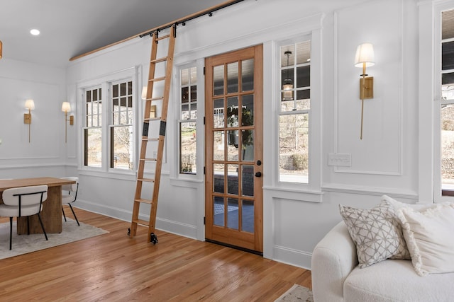 entryway featuring wood finished floors and baseboards