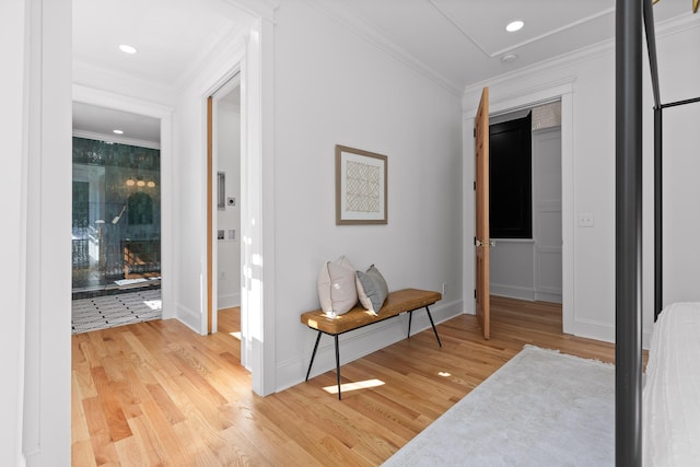 corridor featuring ornamental molding, recessed lighting, baseboards, and wood finished floors