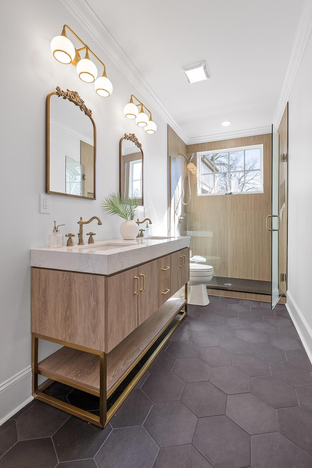 full bath featuring crown molding, double vanity, toilet, a sink, and a shower stall