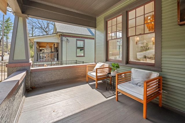 wooden terrace featuring a porch