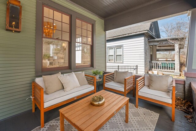 exterior space featuring a porch and an outdoor living space