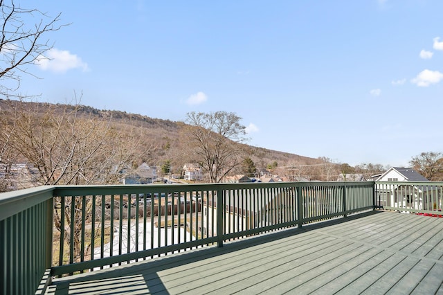 wooden deck featuring a mountain view