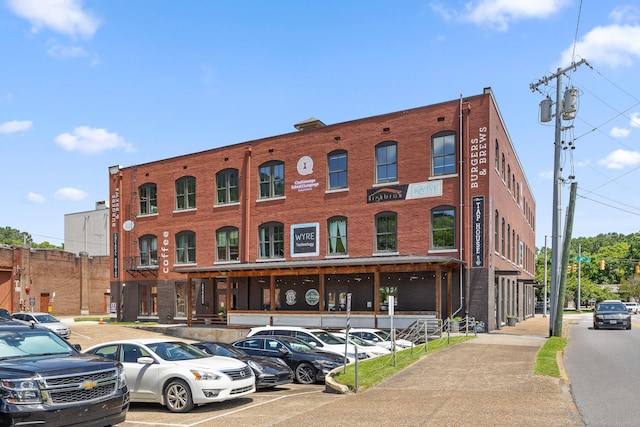 view of property featuring uncovered parking