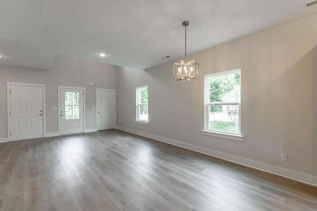 4659 Heiskell Dr, Chattanooga, TN 37416 - unfurnished room featuring a chandelier, wood finished floors, baseboards, and recessed lighting