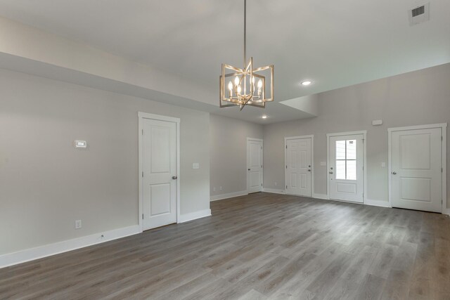 4659 Heiskell Dr, Chattanooga, TN 37416 - spare room with a chandelier, baseboards, recessed lighting, and wood finished floors