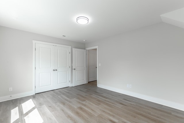 4659 Heiskell Dr, Chattanooga, TN 37416 - unfurnished bedroom featuring light wood-type flooring, baseboards, and a closet