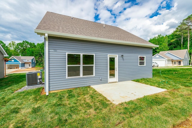4659 Heiskell Dr, Chattanooga, TN 37416 - rear view of property with central AC, a patio area, a yard, and roof with shingles