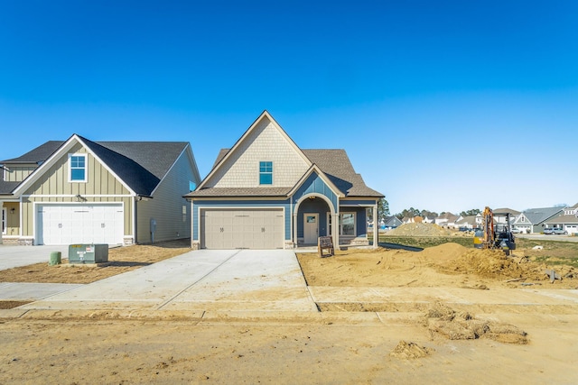 craftsman-style house featuring driveway and board and batten siding