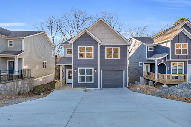 view of front of property with an attached garage and concrete driveway