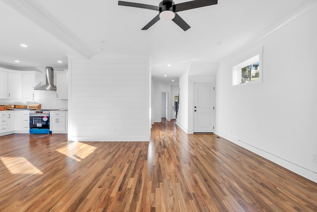 unfurnished living room with light wood-type flooring, baseboards, a ceiling fan, and recessed lighting