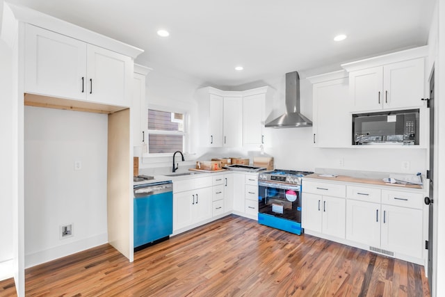 kitchen with black microwave, dishwashing machine, a sink, wall chimney range hood, and stainless steel range with gas stovetop