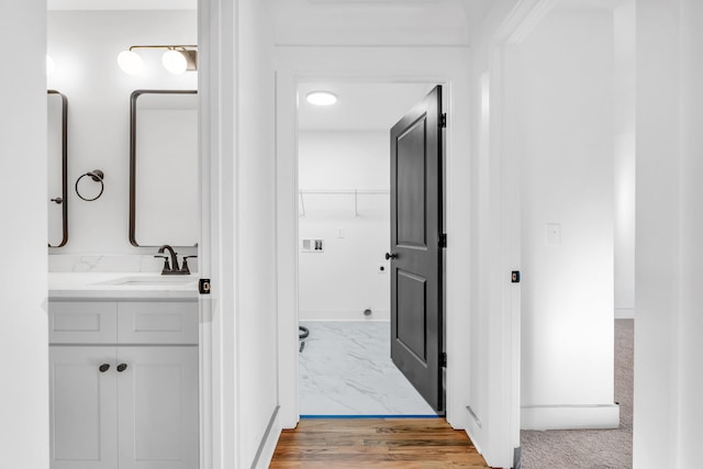 bathroom with marble finish floor and vanity