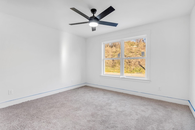 carpeted empty room with ceiling fan