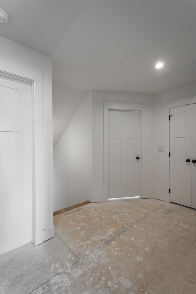 bonus room with baseboards and visible vents