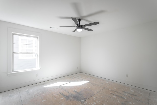 unfurnished room featuring visible vents and a ceiling fan