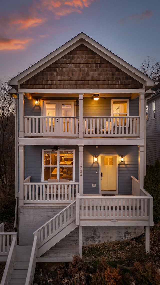 view of front of property with covered porch and a balcony