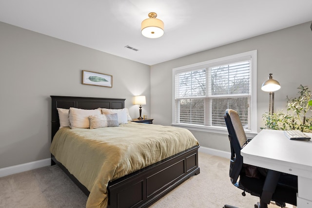 bedroom featuring light carpet, baseboards, and visible vents