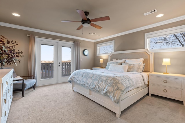 bedroom with light carpet, visible vents, access to outside, crown molding, and french doors