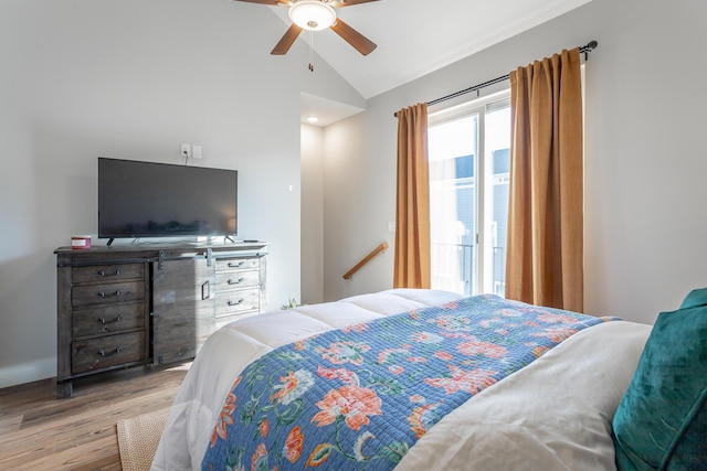 bedroom with lofted ceiling, ceiling fan, and wood finished floors