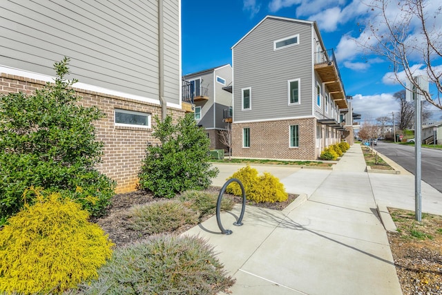 view of side of property with brick siding