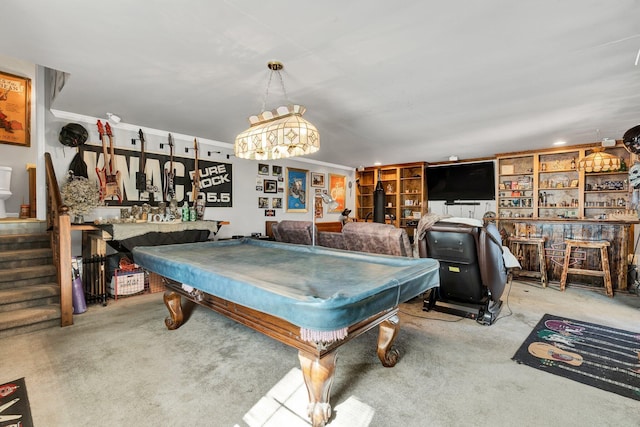 playroom with a dry bar, billiards, ornamental molding, and light colored carpet