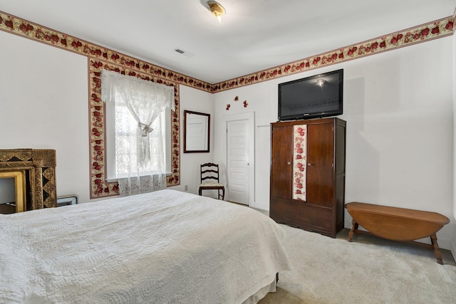 carpeted bedroom with visible vents