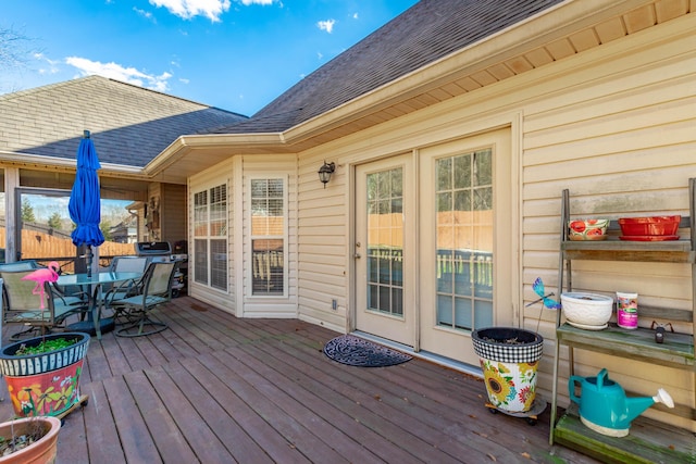 deck with outdoor dining area