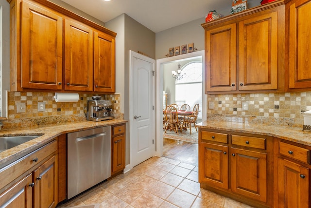 kitchen featuring decorative backsplash, brown cabinetry, light tile patterned flooring, light stone countertops, and dishwasher