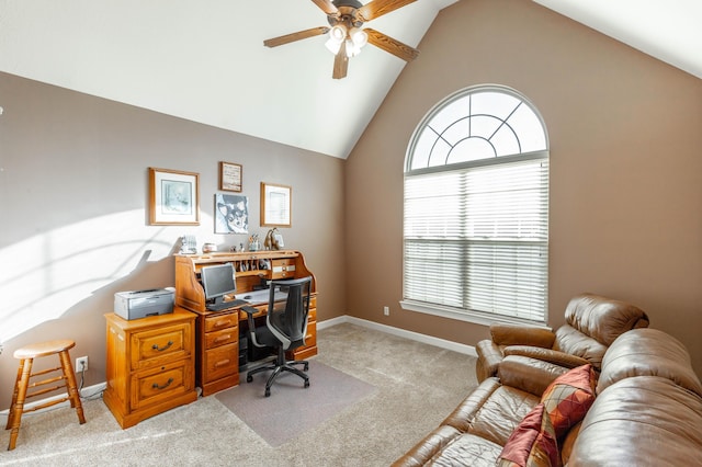 carpeted office space with a ceiling fan, high vaulted ceiling, and baseboards