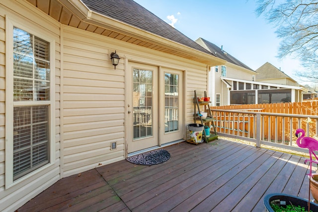 wooden terrace featuring fence