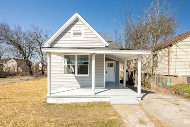 view of front facade featuring a porch and roof with shingles