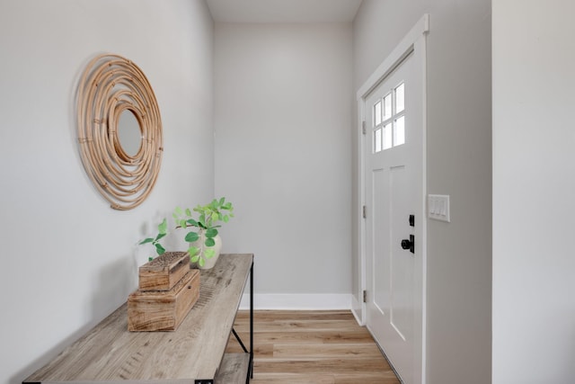 entrance foyer featuring light wood-style floors and baseboards