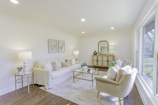 living area with recessed lighting, plenty of natural light, baseboards, and wood finished floors