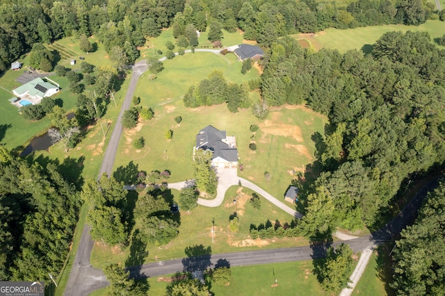 bird's eye view featuring a view of trees