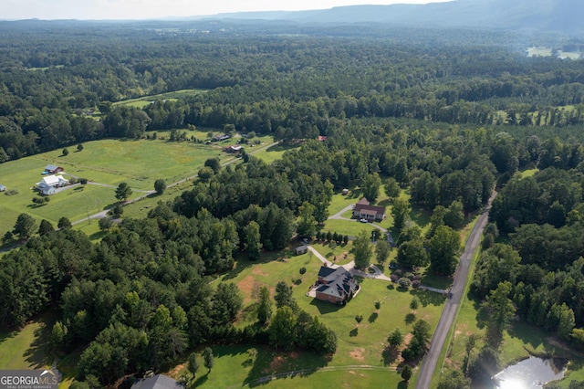 bird's eye view featuring a forest view