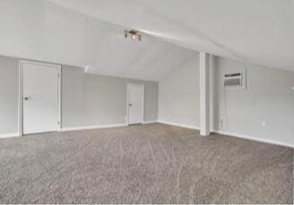 additional living space featuring lofted ceiling, carpet flooring, and baseboards