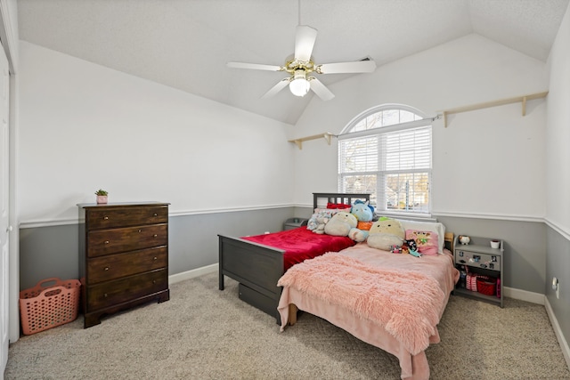 bedroom with vaulted ceiling, ceiling fan, carpet flooring, and baseboards