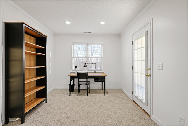 home office featuring light carpet, a textured ceiling, visible vents, and crown molding