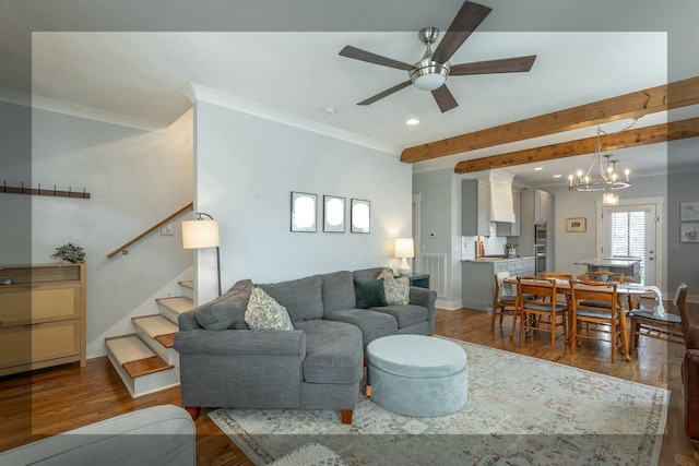 living area featuring ornamental molding, dark wood-type flooring, stairway, and baseboards