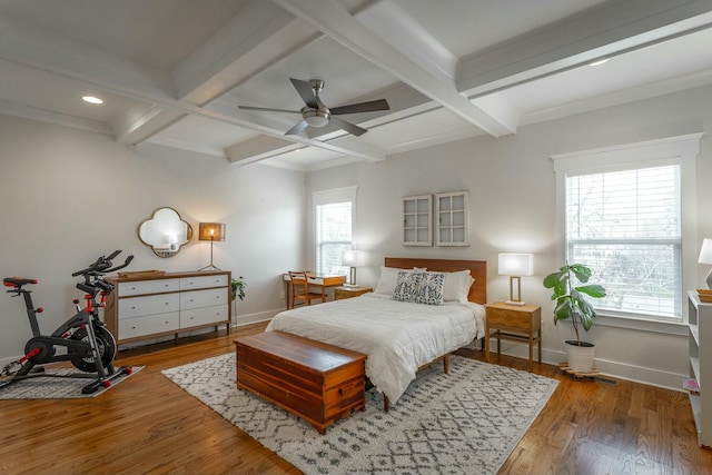 bedroom with baseboards, coffered ceiling, wood finished floors, and beamed ceiling