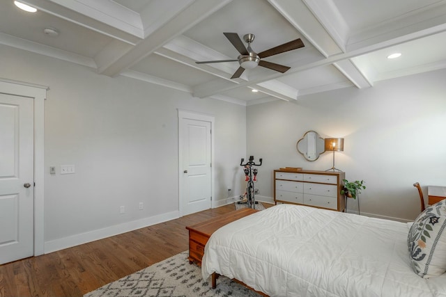 bedroom featuring beamed ceiling, coffered ceiling, wood finished floors, and baseboards