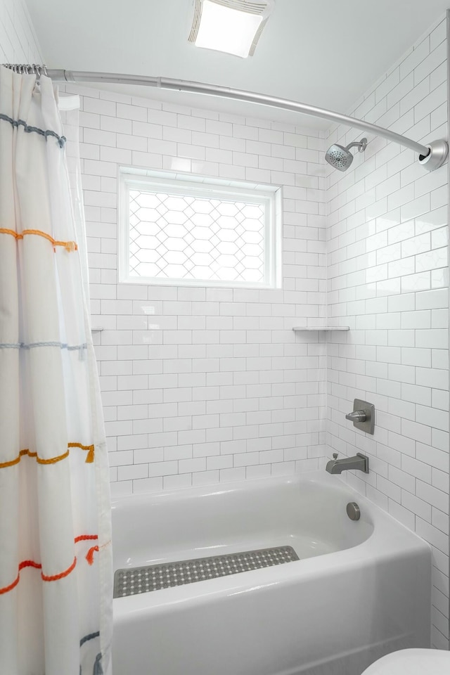 bathroom with shower / bath combo