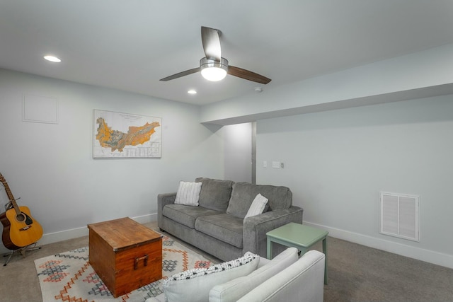 carpeted living room featuring a ceiling fan, recessed lighting, visible vents, and baseboards