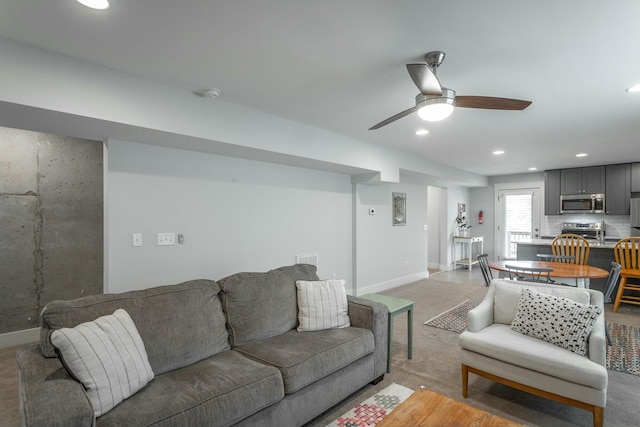 living area featuring ceiling fan, visible vents, baseboards, and recessed lighting