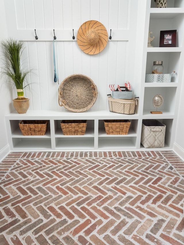 mudroom with brick floor